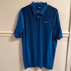 Men’s size large Tiger Woods Nike Golf Polo blue and black in color.